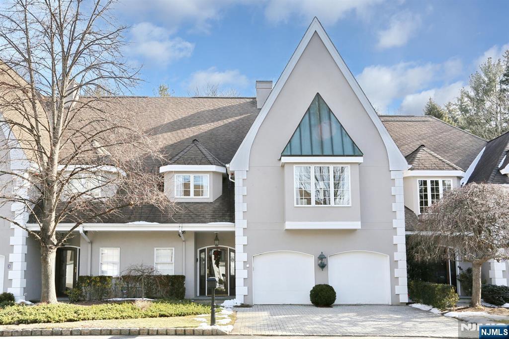 Discover sophisticated, low-maintenance living in Normandy Court, an intimate Ho-Ho-Kus community of just 24 residences. Completely reimagined in 2024, this expansive 4,000+ sqft townhouse spans three beautifully finished levels and offers a fresh, modern approach to everyday living and entertaining. The welcoming center hall leads to a striking new kitchen with quartz countertops, custom cabinetry and premium stainless-steel appliances. An adjoining family room features a gas fireplace and French doors opening to a private patio and backyard. Gracious formal living and dining rooms provide additional space for hosting, with a second gas fireplace adding warmth and character. Upstairs, three spacious bedrooms each offer a private renovated bath and generous closet space. The primary suite is a true retreat with four closets and a luxurious bath highlighted by a freestanding soaking tub. A dedicated laundry room is conveniently located on this level. The finished third floor provides exceptional flexibility as a fourth bedroom, home office, recreation room or guest space, plus plentiful storage. Additional amenities include hardwood floors, 9-foot ceilings, a heated garage, new central air conditioning, smart thermostats, central vacuum and a security system. Stylish, spacious and completely move-in ready, this exceptional home offers a rare opportunity in one of Ho-Ho-Kusâ€™ most desirable enclaves.