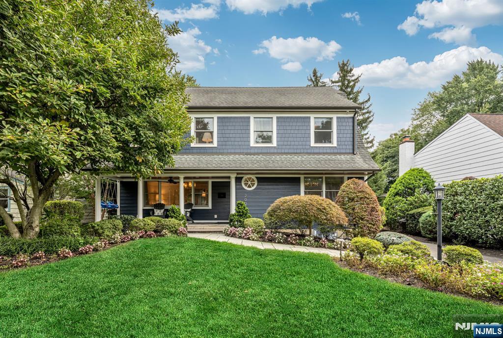 Welcome to 200 Katherine Road, a beautifully appointed six-bedroom Ridgewood home offering approximately 3,400+ sqft of living space on an exceptional park-like property. Combining timeless architectural details with thoughtful modern updates, this inviting residence offers the space, elegance, and versatility today's buyers are looking forâ€”all in one of Ridgewood's most desirable neighborhoods. From the moment you enter, the home's gracious scale and sophisticated character are evident. Coffered ceilings, beautiful millwork, and generously proportioned rooms create an atmosphere of elegance and warmth. A generously sized dining room, enhanced by handsome millwork, provides an elegant setting for holidays and gatherings. The spacious living room features a wonderful picture window and French doors leading to the kitchen eating area, creating an easy connection between the home's formal and casual spaces. The second floor features a luxurious primary suite three additional corner bedrooms offer excellent natural light and generous proportions, complemented by an updated full bathroom. The third floor provides more flexibility with two generously sized bedrooms and another updated full bathroom. The finished basement adds valuable recreational space, with a fully finished play area, laundry, and room for storage. The expansive grounds provide a beautiful private setting for outdoor entertaining, play, gardening, or simply enjoying a quiet afternoon surrounded by nature!