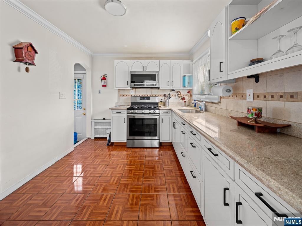 Photo 4 of Single family home for sale at 18-20 Emerson Ave, Paterson, NJ 07502 | MLS# 26033560 | Listing updated on 2026-09-16