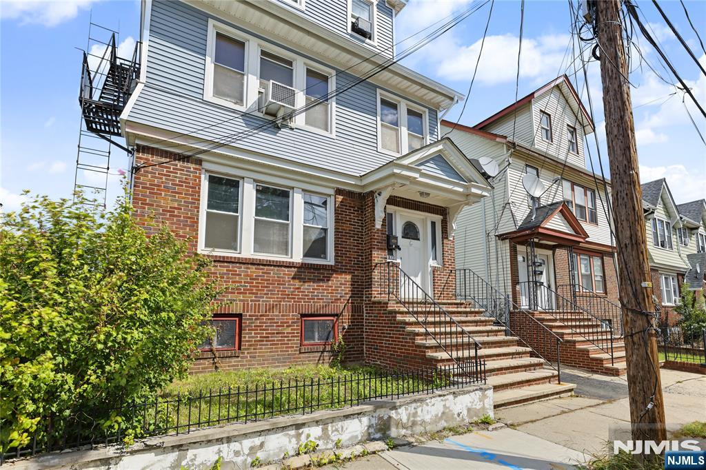 Photo 2 of Multi family home for sale at 102 Delmar Pl, Irvington, NJ 07111 | MLS# 26036477 | Listing updated on 2026-10-08